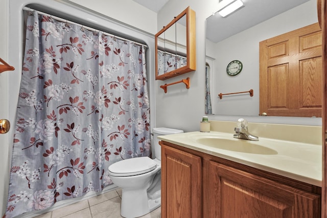 bathroom featuring curtained shower, toilet, vanity, and tile patterned flooring