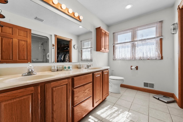 full bath with tile patterned flooring, visible vents, and a sink