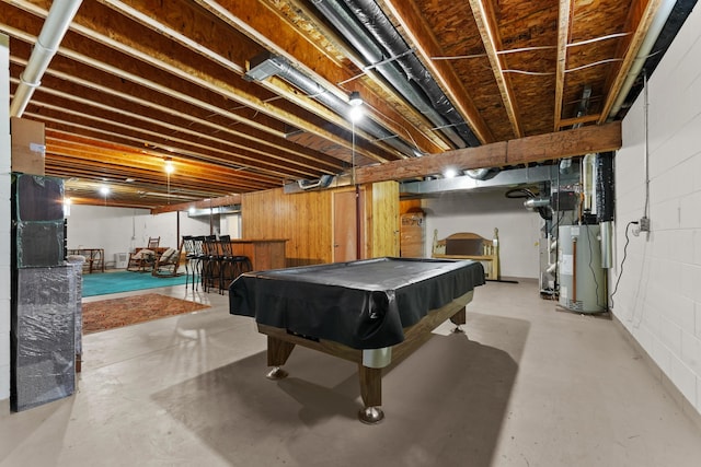 game room featuring gas water heater, concrete block wall, concrete flooring, and pool table