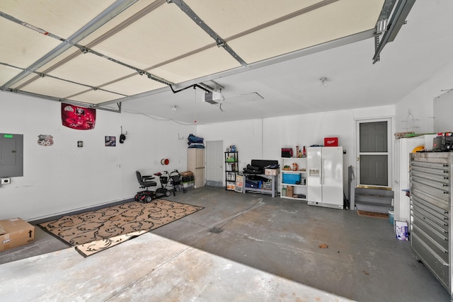 garage with electric panel, a garage door opener, and white fridge with ice dispenser