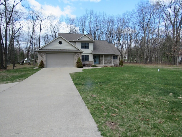 traditional home with a garage, a front yard, concrete driveway, and stone siding