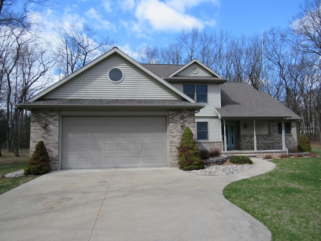 view of front facade featuring concrete driveway, an attached garage, and brick siding
