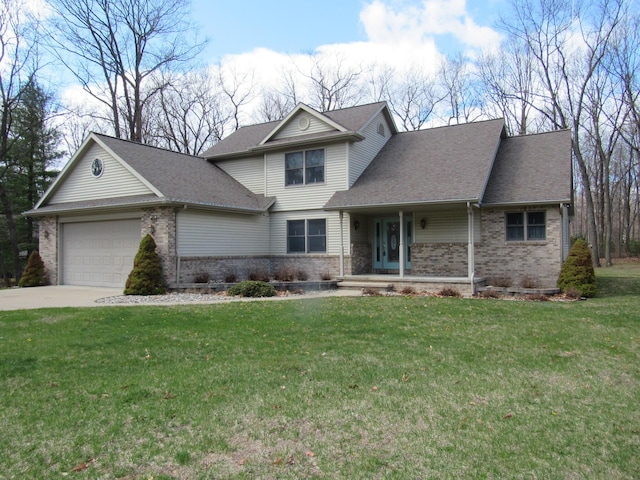 craftsman house with a front yard, brick siding, and a garage