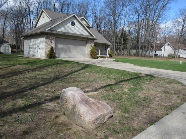 exterior space with concrete driveway, a yard, a garage, and a shingled roof