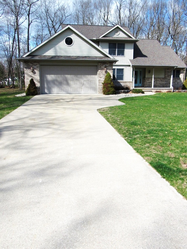 view of front of house featuring driveway, a garage, a front yard, and stone siding
