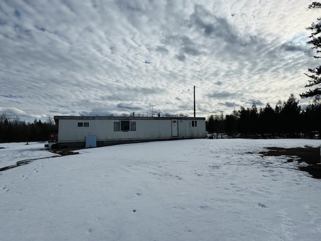 view of snow covered house