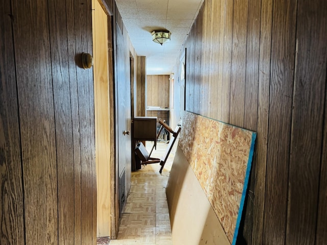 hallway with wooden walls