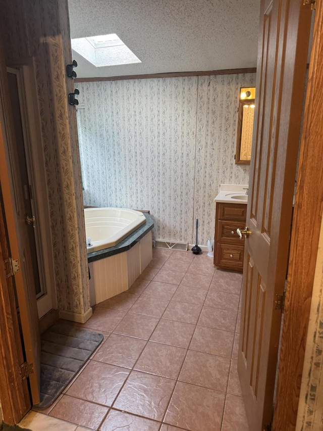 full bathroom with wallpapered walls, a skylight, a textured ceiling, crown molding, and tile patterned floors