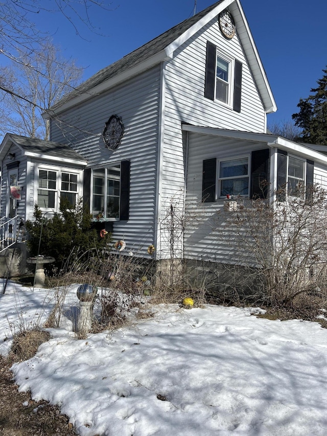 view of front of house with a sunroom