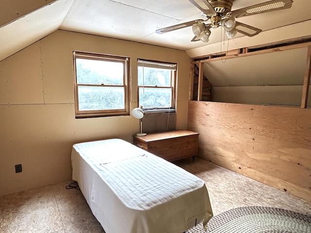 8610 Lincoln Bay Dr, Alpena, MI 49707 - unfurnished bedroom featuring a ceiling fan and vaulted ceiling