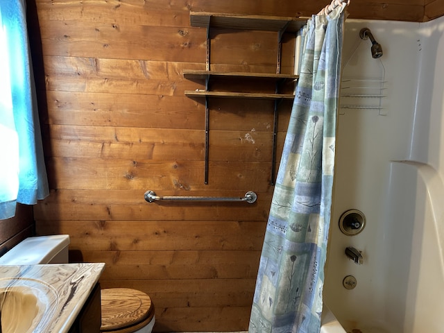 8610 Lincoln Bay Dr, Alpena, MI 49707 - bathroom with vanity, toilet, shower / bathtub combination with curtain, and wood walls