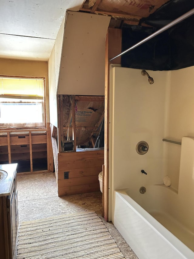8610 Lincoln Bay Dr, Alpena, MI 49707 - bathroom with vanity, toilet, and shower / bathtub combination