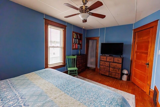 bedroom featuring a ceiling fan and wood finished floors