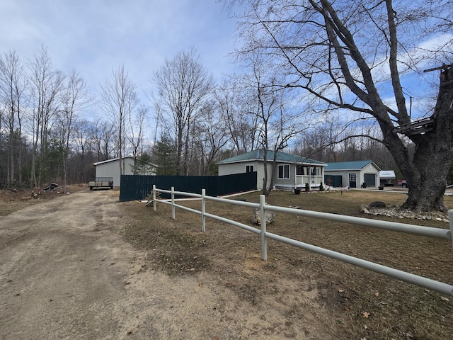 exterior space with driveway and fence