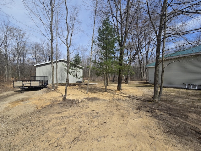 view of yard featuring an outbuilding and a deck