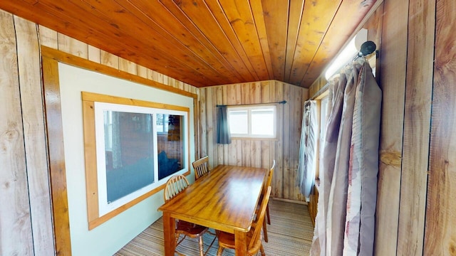 unfurnished sunroom featuring wooden ceiling and vaulted ceiling