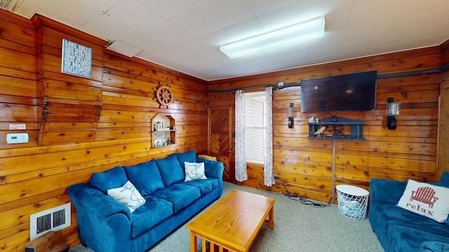 carpeted living area featuring visible vents