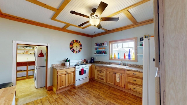 kitchen with light wood-style flooring, a sink, open shelves, white appliances, and stacked washer / drying machine