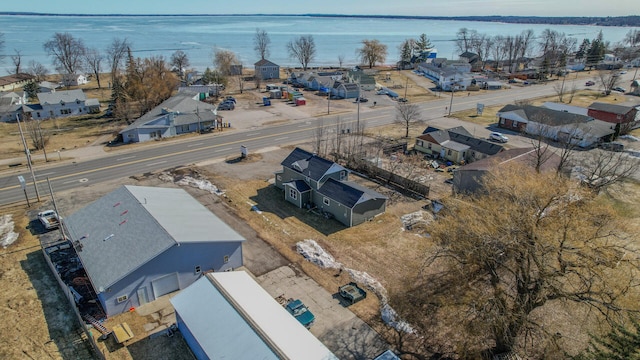 birds eye view of property featuring a residential view and a water view