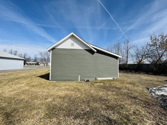 view of property exterior with a lawn