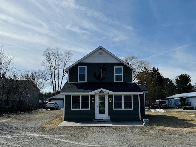 view of front of home featuring a shingled roof