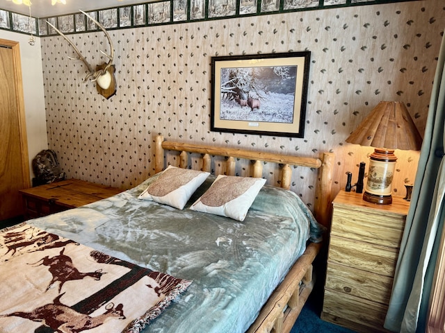 bedroom featuring wallpapered walls