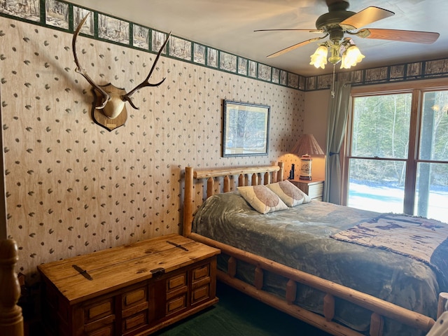 bedroom with wallpapered walls