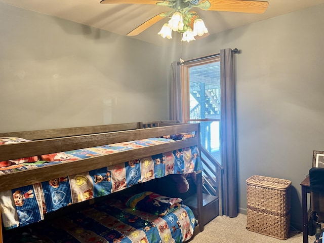 carpeted bedroom featuring a ceiling fan