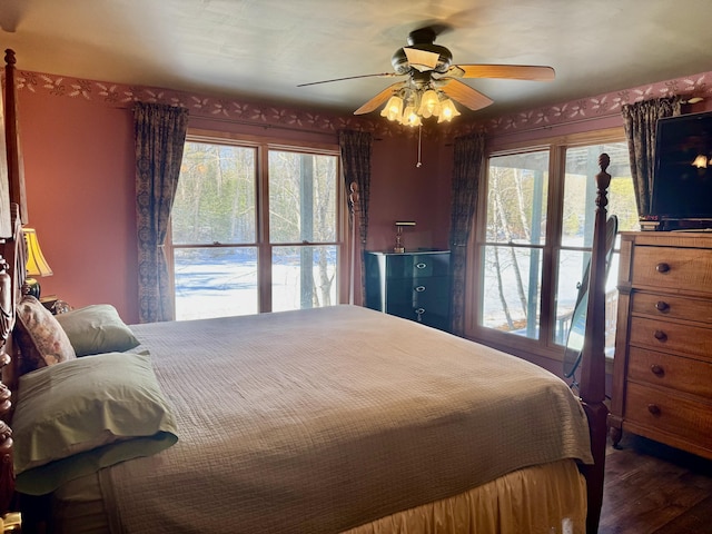 bedroom with a ceiling fan and wood finished floors