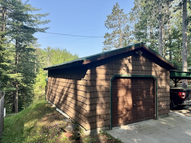 2305 Kirk Rd, Fairview, MI 48621 - detached garage featuring driveway