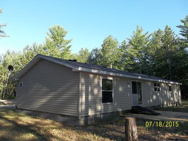 view of side of home featuring crawl space