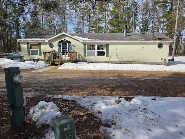 view of front of house featuring a wooden deck