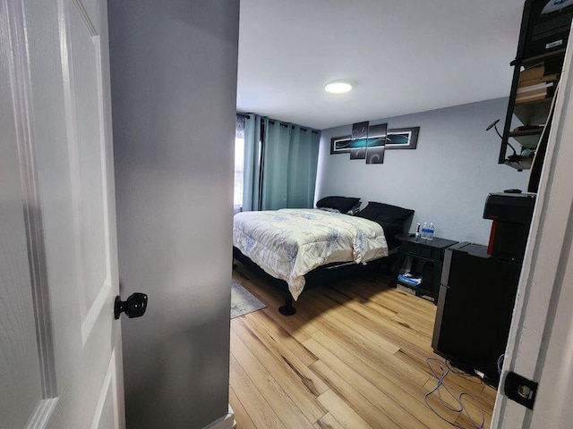 bedroom featuring light wood-style floors