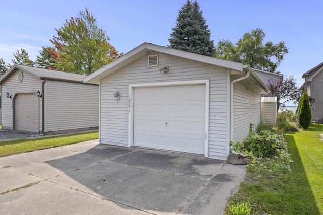 garage featuring driveway