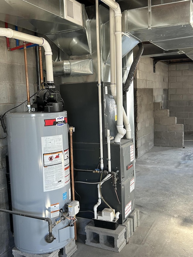 utility room featuring water heater