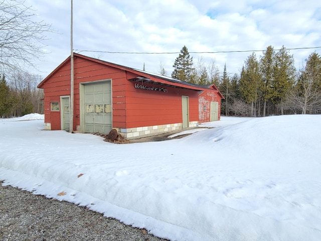 view of snow covered garage