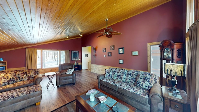 living area with rail lighting, high vaulted ceiling, wood finished floors, and wooden ceiling