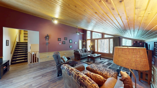 living area with stairway, wood ceiling, lofted ceiling, and wood finished floors