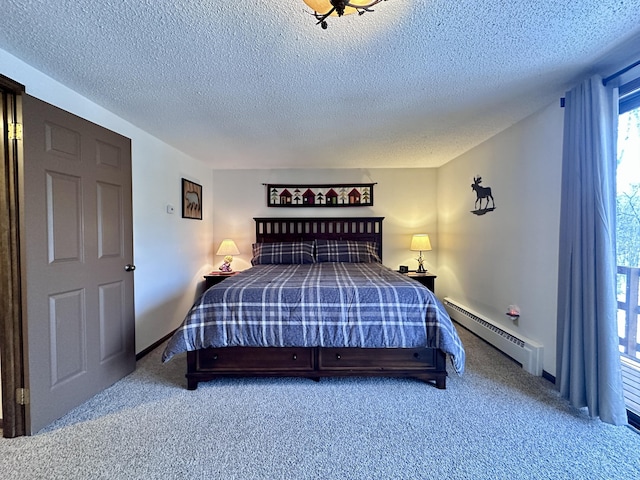 bedroom featuring carpet flooring, a textured ceiling, and a baseboard heating unit