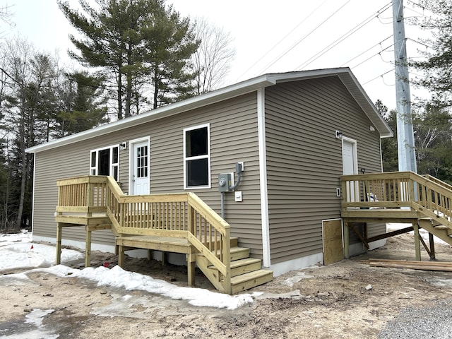 rear view of property with a deck