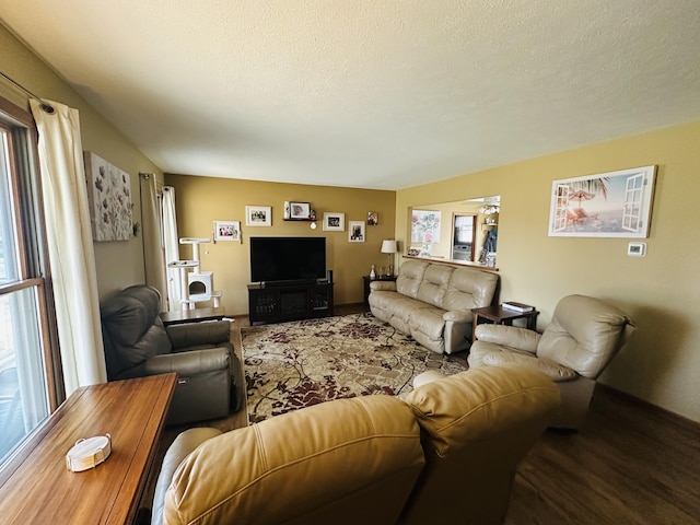 living area featuring a textured ceiling