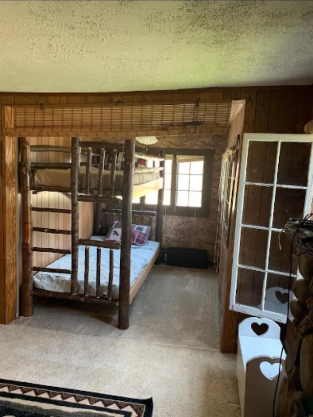 unfurnished bedroom with carpet and a textured ceiling