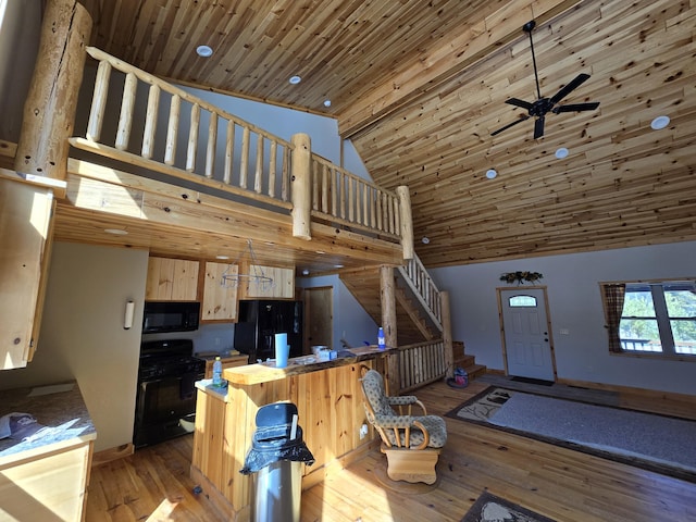 kitchen with wood ceiling, high vaulted ceiling, black appliances, and wood-type flooring