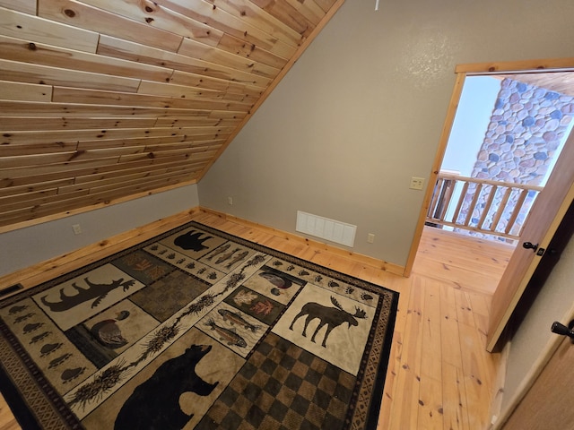 bonus room featuring vaulted ceiling, wood-type flooring, visible vents, and wooden ceiling