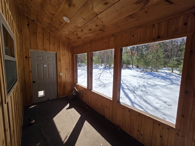 unfurnished sunroom with lofted ceiling and wood ceiling