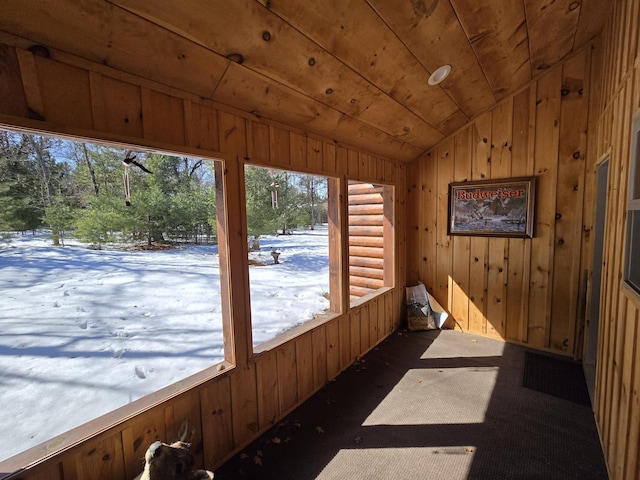 sunroom / solarium featuring wood ceiling and vaulted ceiling