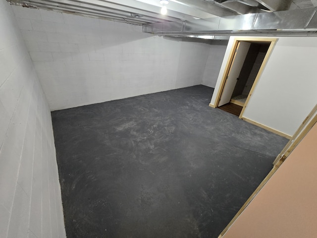 basement featuring concrete block wall