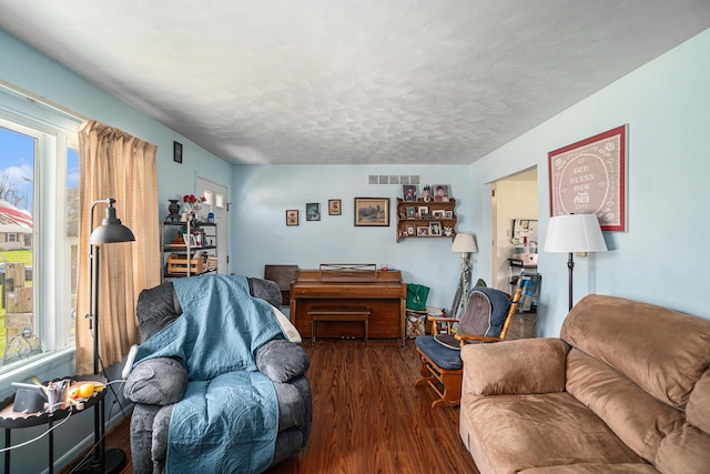1114 Brooktrout Ln, Gaylord, MI 49735 - living area with wood finished floors and a textured ceiling