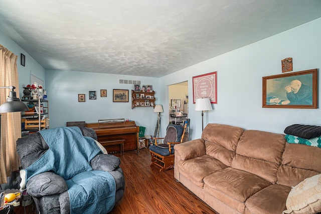 1114 Brooktrout Ln, Gaylord, MI 49735 - living room featuring wood finished floors and a textured ceiling