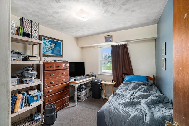 1114 Brooktrout Ln, Gaylord, MI 49735 - bedroom with a textured ceiling, a desk, and carpet floors